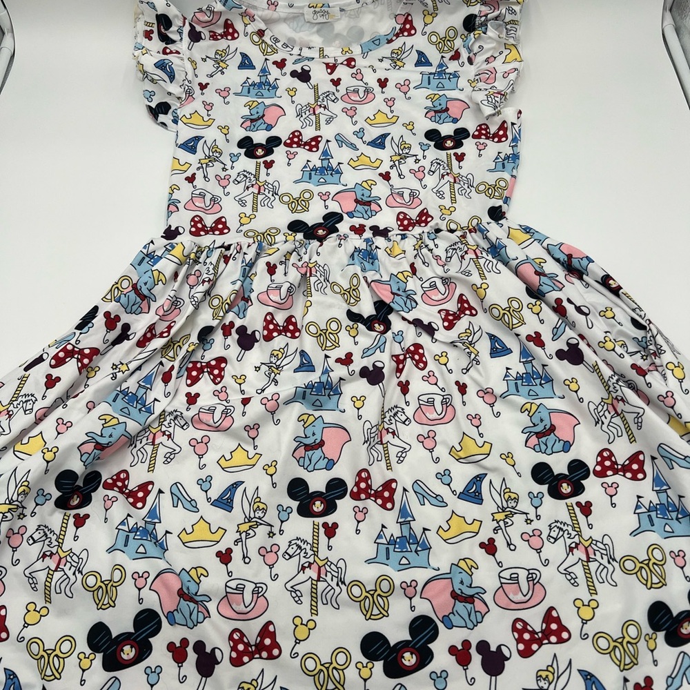 Gussy up bow Disney”The Parks”dress from the happiest place on Earth collection